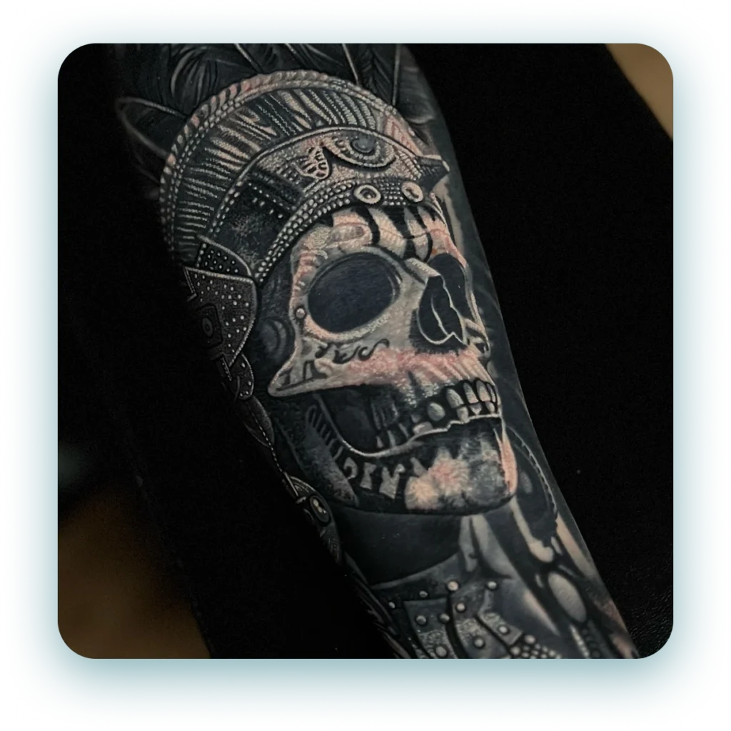 black-and-grey-realism-ancient-indian-skull-arm-sleeve-tattoo